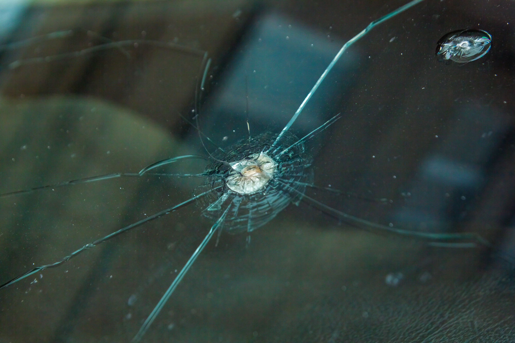 Picture of cracked windshield caused by stone chip