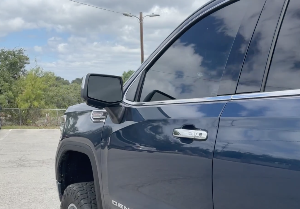 Modified side mirrors on GMC vehicle