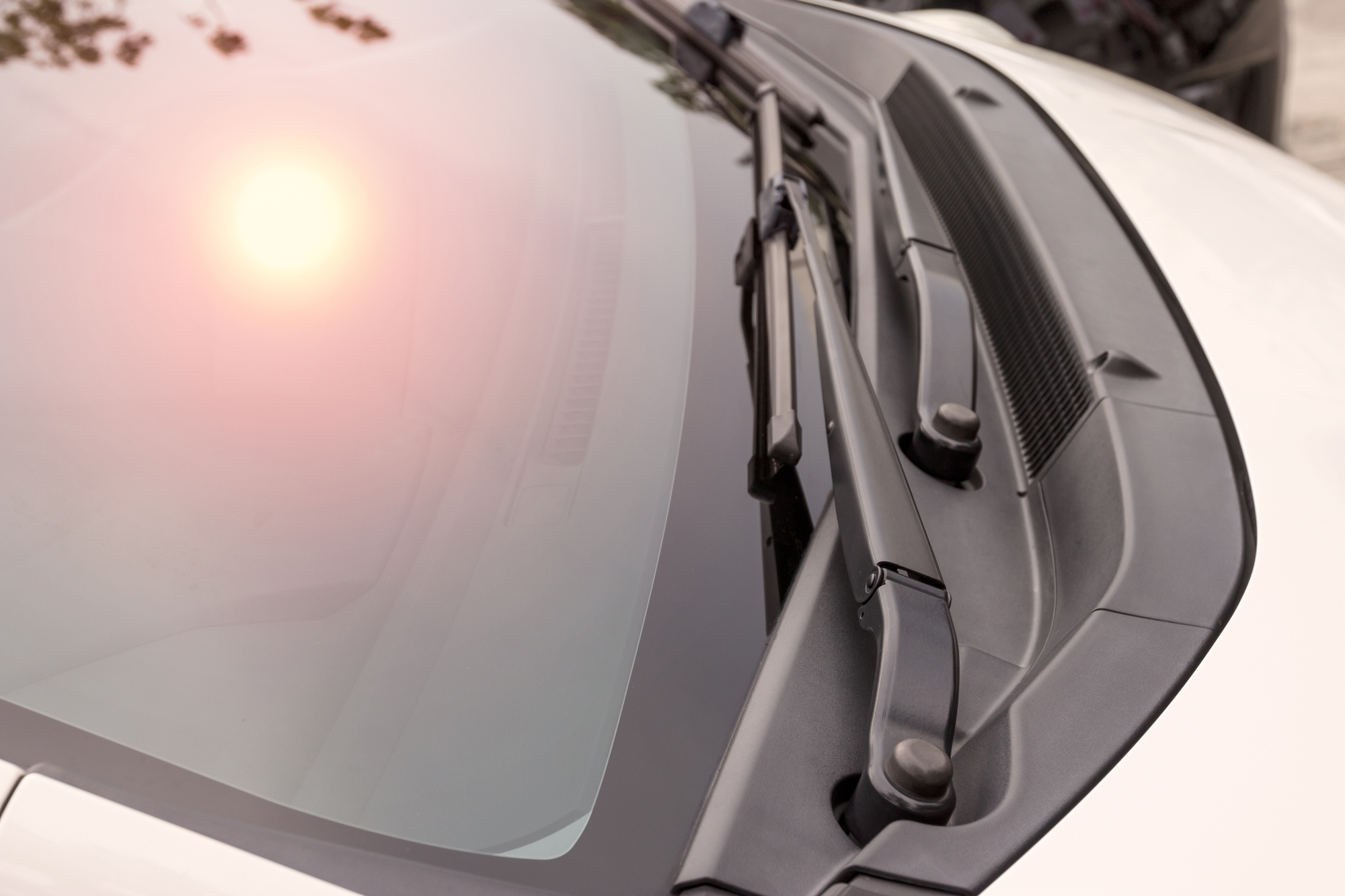 Sun reflection on car's windshield, close-up