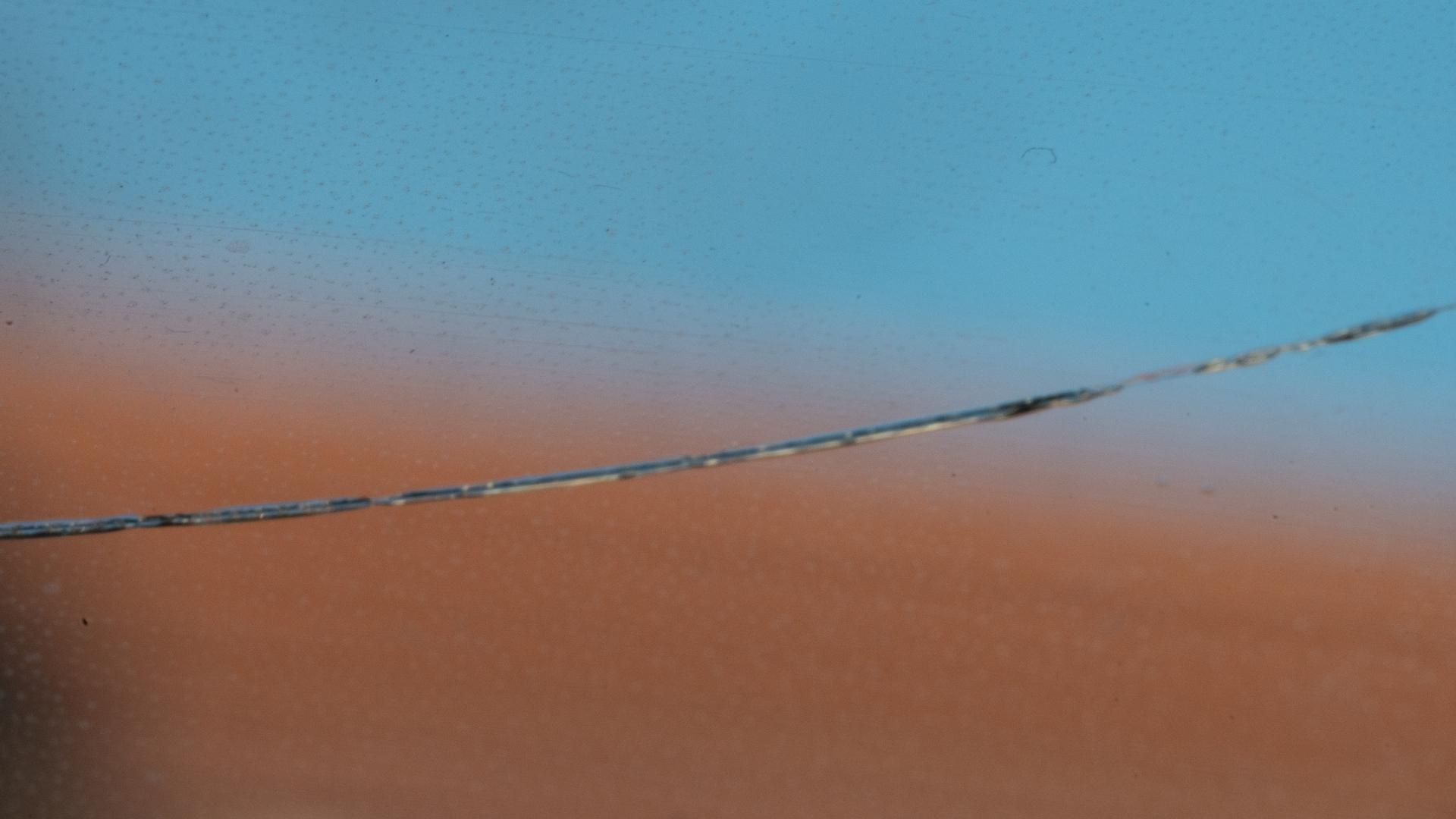 Close up of a long crack in a windshield